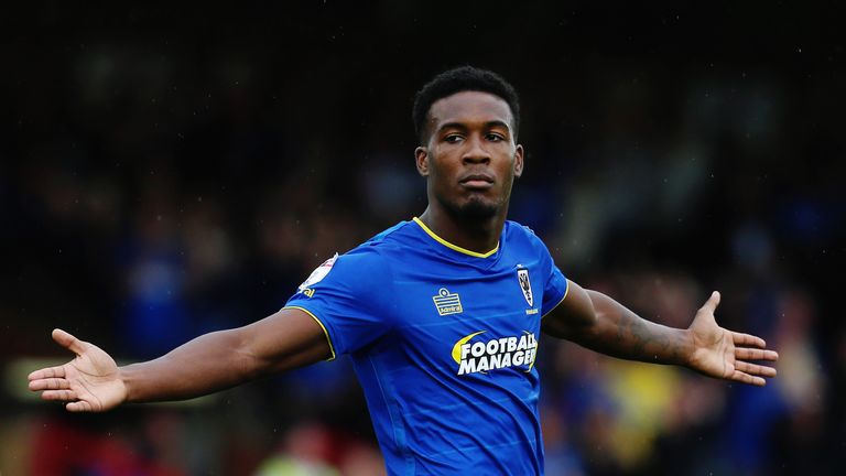 Dominic Poleon celebrates AFC Wimbledon's vital winning goal