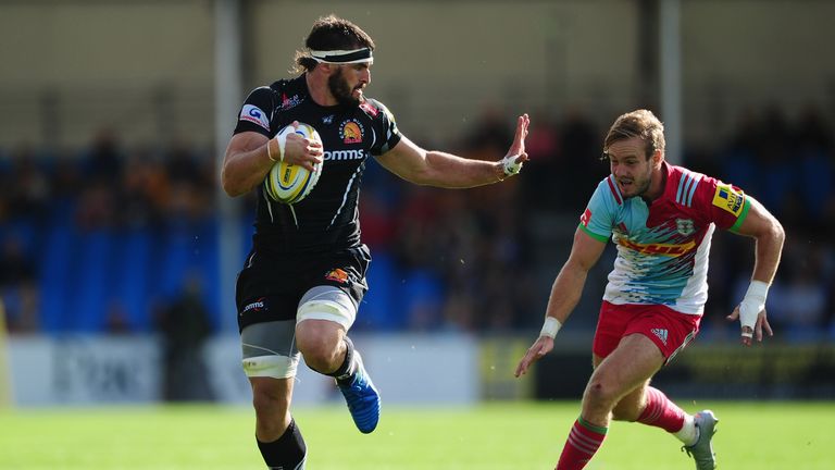 Don Armand fends off the attentions of Harlequins' Charlie Walker