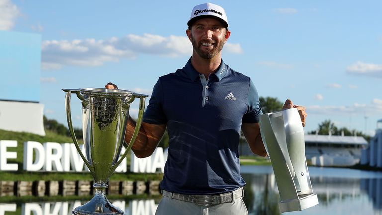 CARMEL, IN - SEPTEMBER 11:  Dustin Johnson poses with the championship trophies after a three stroke victory at the BMW Championship at Crooked Stick Golf 