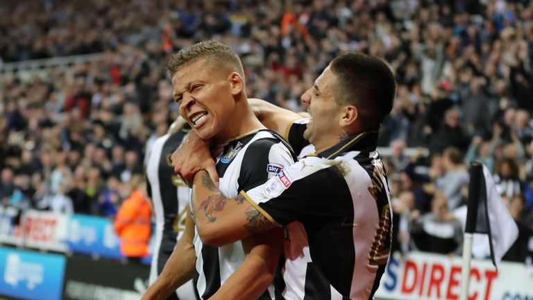Newcastle's Dwight Gayle celebrates with Aleksandar Mitrovic after scoring the late winner