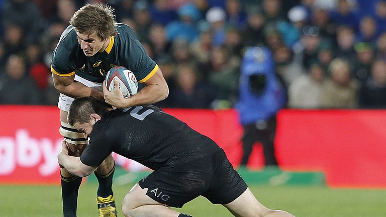 Eben Etzebeth is tackled by New Zealand hooker Dane Coles  during the South Africa versus New Zealand test match in Johannesburg In July 2015