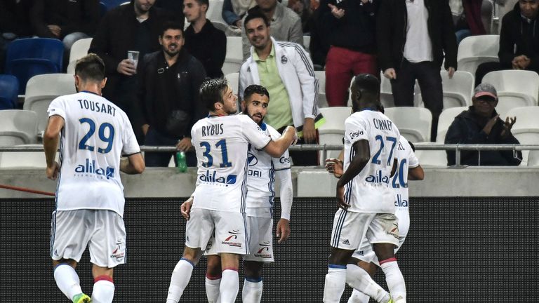 Lyon's French midfielder Nabil Fekir (C) celebrates with his teamates after scoring a goal during the French L1 football match between Olympique Lyonnais (