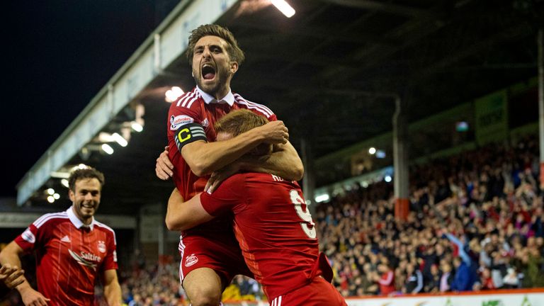 Adam Rooney celebrates with Graeme Shinnie after grabbing the late winner