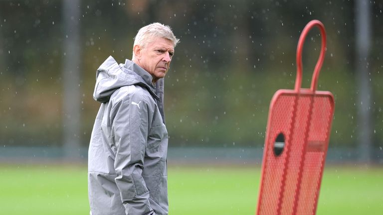 Arsenal manager Arsene Wenger looks on during a training session at London Colney