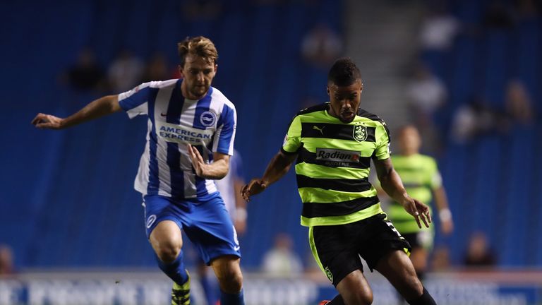 Elias Kachunga of Huddersfield is tackled by Dale Stephens of Brighton during the Sky Bet Championship match between Brighton and Hudddersfield