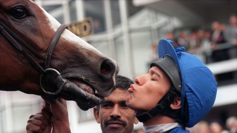 Frankie Dettori kisses his mount, Mark of Esteem, after their triumph in the Queen Elizabeth II Stakes