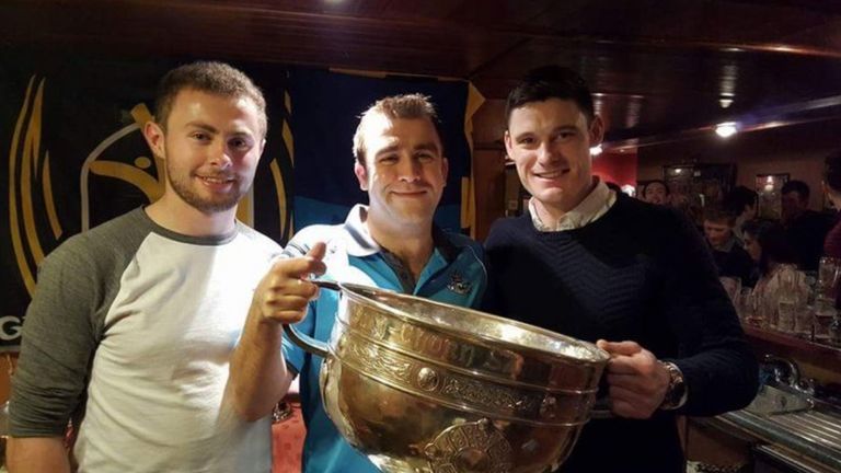 Dublin fan John O'Neill (middle) with Diarmuid Connolly (right), Jack McCaffrey and the Sam Maguire Cup