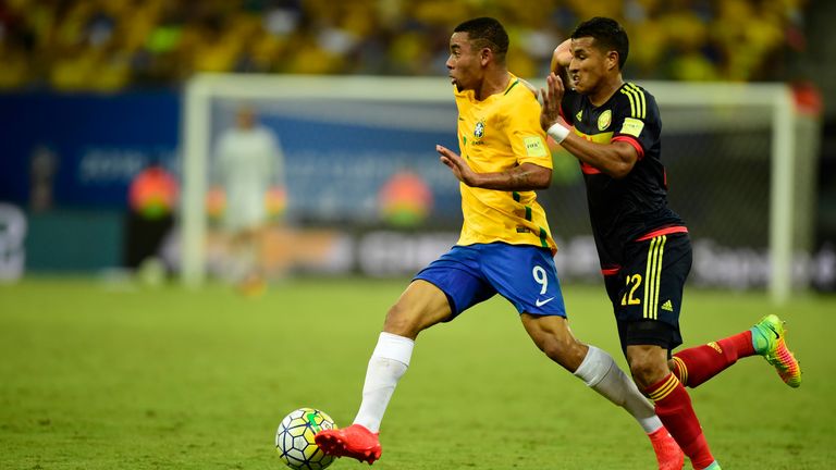 Gabriel Jesus [left] looks to escape the attention of a Colombian defender