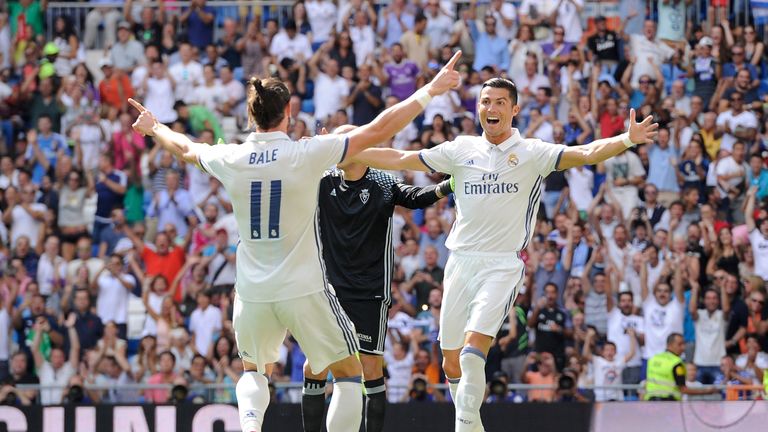 MADRID, SPAIN - SEPTEMBER 10: Cristiano Ronaldo of Real Madrid celebrates with Gareth Bale after scoring opening goal during the La Liga match between R