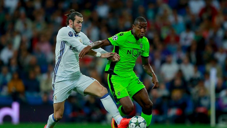 MADRID, SPAIN - SEPTEMBER 14: Gareth Bale (L) of Real Madrid CF competes for the ball with Marvin Zeegelaar (R) of Sporting CP during the UEFA Champions Le