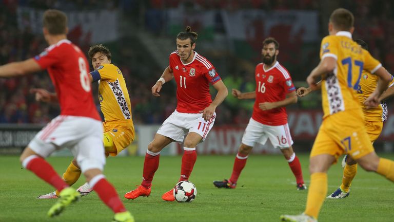 Wales' forward Gareth Bale (C) controls the ball during the World Cup 2018 football qualification match between Wales and Moldova at Cardiff City Stadium 
