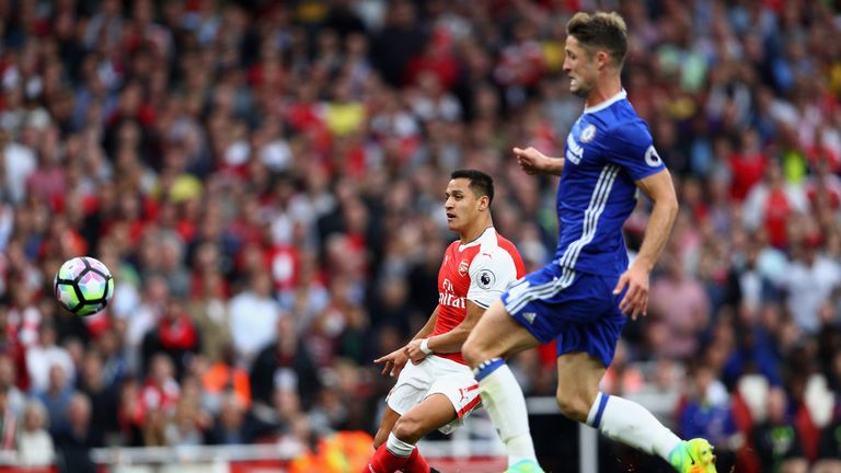 Alexis Sanchez of Arsenal scores his sides first goal during the Premier League match between Arsenal and Chelsea at the E