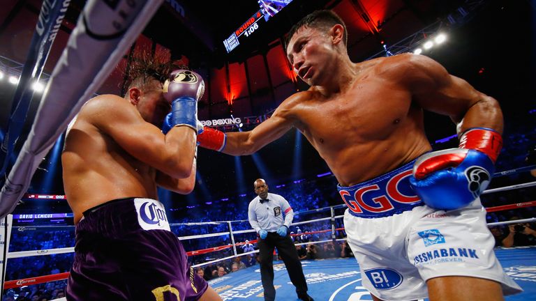 Gennady Golovkin punches David Lemieux during their WBA/WBC interim/IBF middleweight title unification bout at MSG.