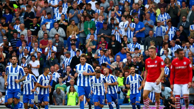 BRIGHTON, ENGLAND - SEPTEMBER 24:  Glenn Murray of Brighton & Hove Albion celebrates with team-mates after scoring his team's second goal during the Sky Be