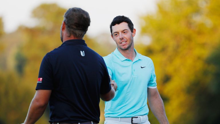 ATLANTA, GA - SEPTEMBER 25:  Rory McIlroy of Northern Ireland (R) shakes hands with Ryan Moore after defeating Moore on the fourth playoff hole to win the 