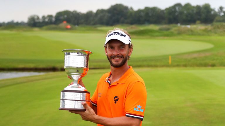 Joost Luiten celebrates victory with the trophy after the final round on day four of the KLM Open