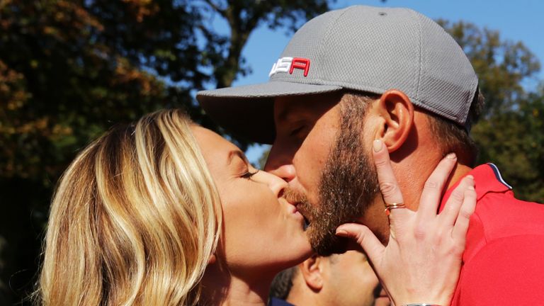 Paulina Gretzky gives her boyfriend Dustin Johnson a kiss after the end of the round during morning foursome matches