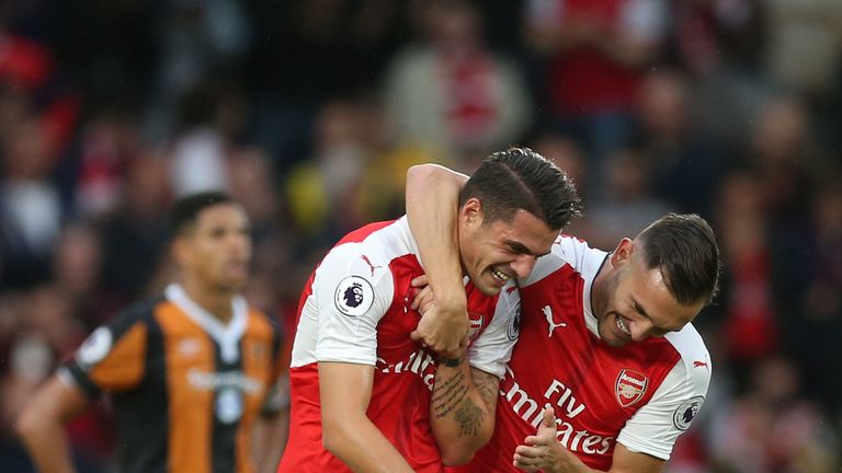 Granit Xhaka of Arsenal celebrates scoring his side's first goal v Hull City with team-mate Lucas Perez during the Premier League match at the KCOM Stadium