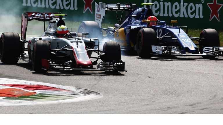 Haas driver Esteban Gutierrez locks up as he overtakes the Sauber of Felipe Nasr