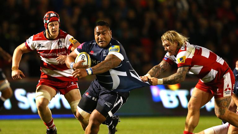 Halani Aulika of Sale Sharks is tackled by Richard Hibbard of Gloucester Rugby
