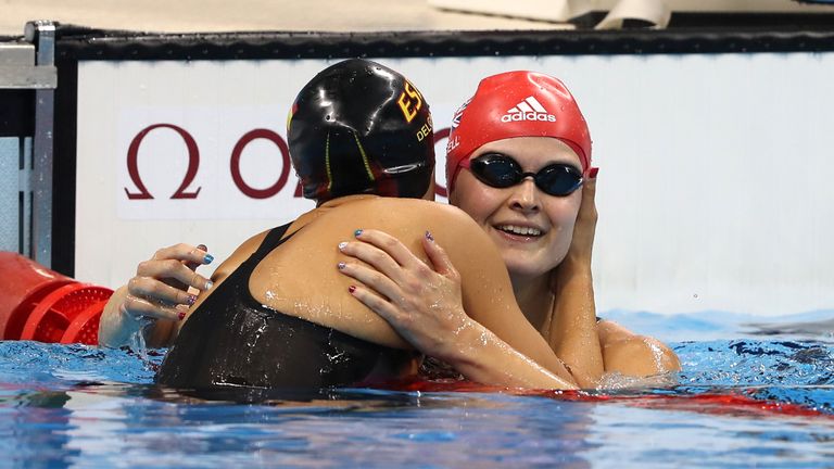 Great Britain's Hannah Russell is congratulated by Spain's Maria Delgado Nadal after winning the Women's 100 metres backstroke S12 final during the seventh