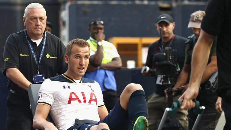 LONDON, ENGLAND - SEPTEMBER 18: Harry Kane of Tottenham Hotspur is put onto a stretcher after coming off injured during the Premier League match between To