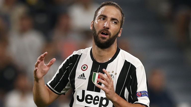 Juventus' Argentinian forward Gonzalo Higuain reacts during the UEFA Champions League football match between Juventus and FC Sevilla on September 14, 2016 