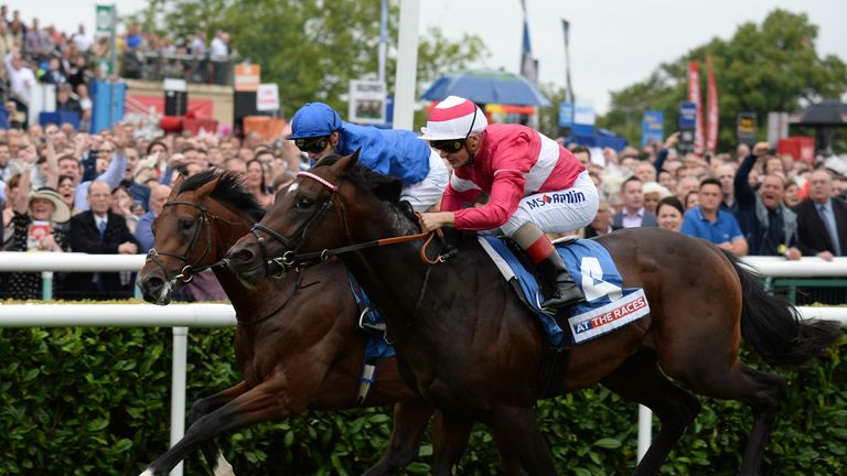 Rivet and Andrea Atzeni (right) get the better of Thunder Snow and James Doyle to win the At The Races Champagne Stakes.