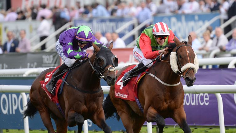 Wall of Fire ridden by Josephine Gordon (left) beats Seamour ridden by George Baker to win the Ladbrokes Mallard Stakes.