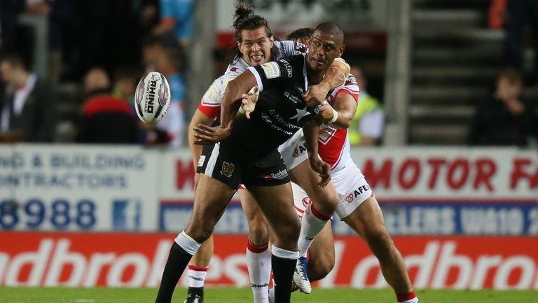 Hull FC's Leon Pryce is tackled by St Helens Louie McCarthy-Scarsbrook