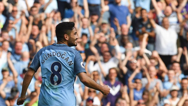 Ilkay Gundogan celebrates scoring Man City's fourth goal against Bournemouth