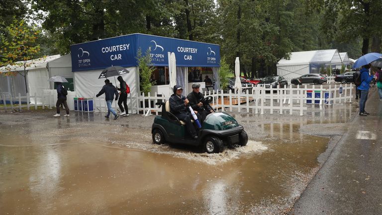 MONZA, ITALY - SEPTEMBER 15:  Tournament officials tour the course as play is suspended due to the threat of lightning during the first round of the Italia