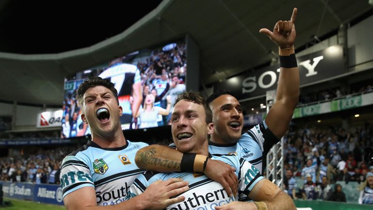  James Maloney of the Sharks celebrates with his team mates after scoring a try against  North Queensland 