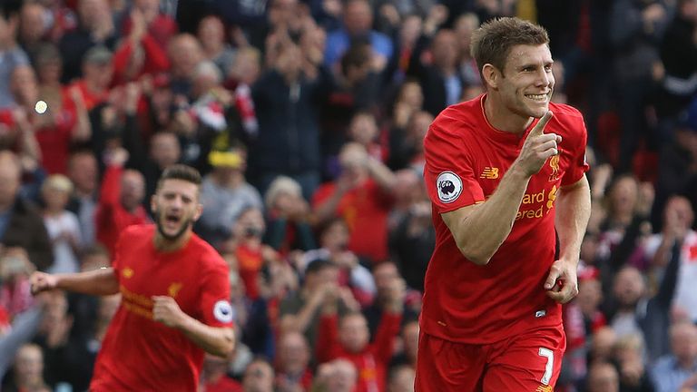 Liverpool midfielder James Milner (R) celebrates after scoring from the penalty spot 