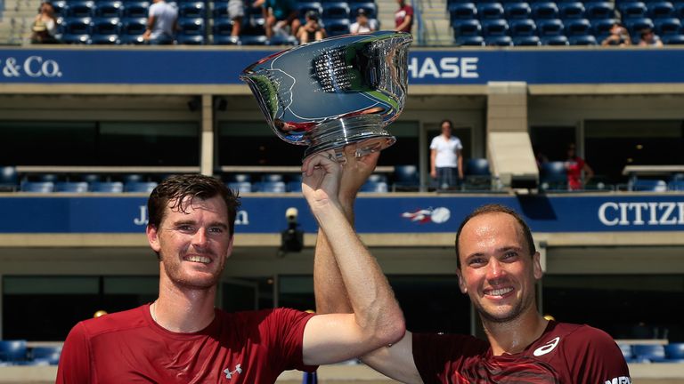 Jamie Murray and Bruno Soares  celebrate with the US Open trophy 