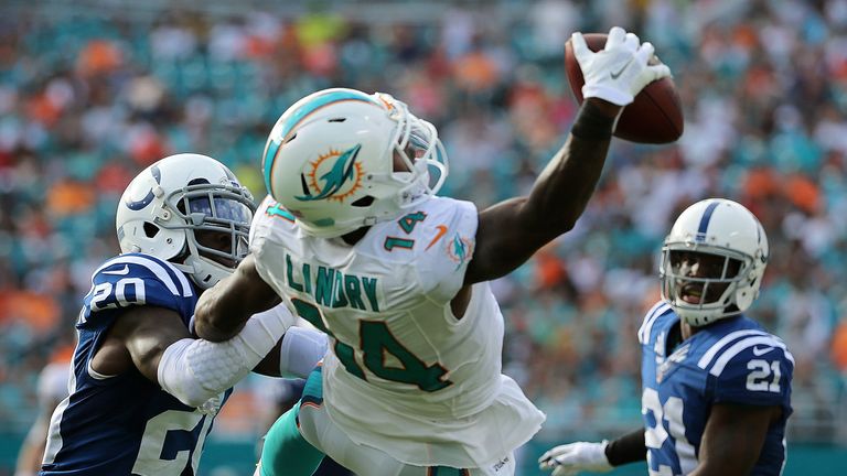 MIAMI GARDENS, FL - DECEMBER 27:  Jarvis Landry #14 of the Miami Dolphins makes a one handed catch during a game against the Indianapolis Colts at Sun Life