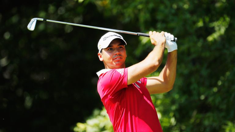 Day admitted to feeling sharp pain in his back during his first round