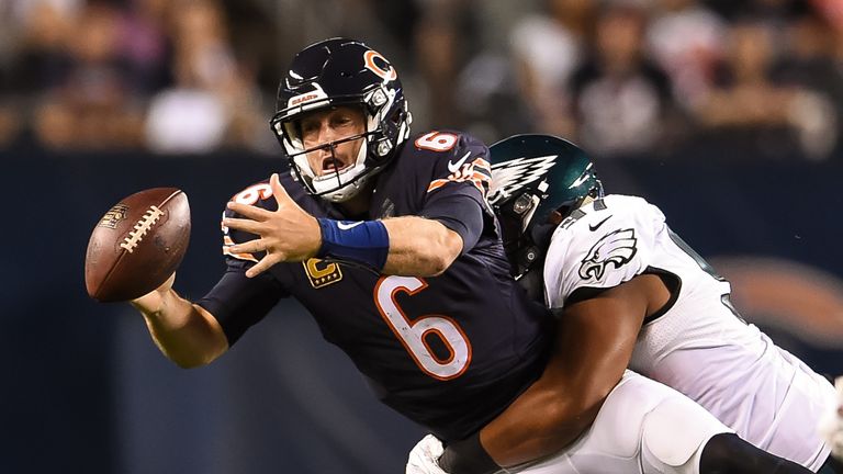 CHICAGO, IL - SEPTEMBER 19:  Quarterback  Jay Cutler #6 of the Chicago Bears fumbles the football against  Destiny Vaeao #97 of the Philadelphia Eagles in 
