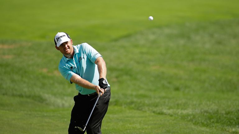 CARMEL, IN - SEPTEMBER 11:  J.B. Holmes chips to the fourth green during the final round of the BMW Championship at Crooked Stick Golf Club on September 11