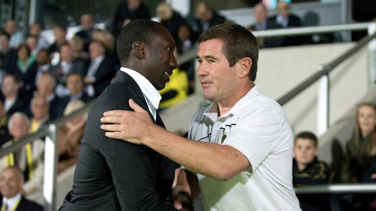 Nigel Clough, manager of Burton Albion and Jimmy Floyd Hasselbaink, manager of Queens Park Rangers shake hands