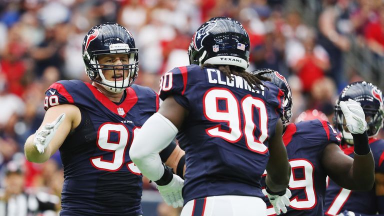 HOUSTON, TX - SEPTEMBER 18:  J.J. Watt #99 and  Jadeveon Clowney #90 of the Houston Texans celebrate a play in the first quarter of their game against the 