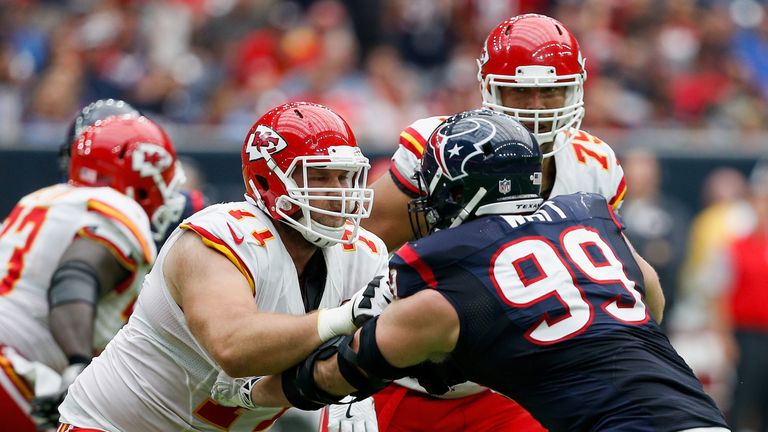 HOUSTON, TX - SEPTEMBER 18:  J.J. Watt #99 of the Houston Texans is double teamed by Mitchell Schwartz #71 of the Kansas City Chiefs and Jah Reid #75 at NR