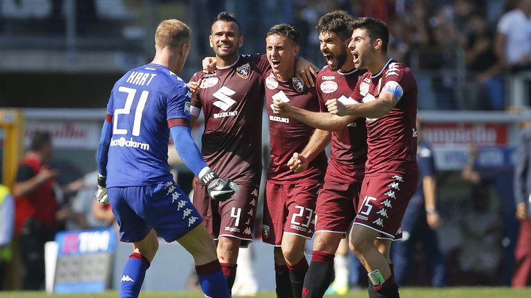 Torino's players celebrate at the end of the Italian Serie A football match between Torino and AS Roma at the "Grande Torino" Stadium in Turin on September