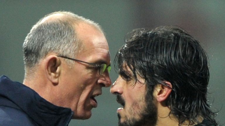 AC Milan's midfielder Gennaro Ivan Gattuso (R) argues with Tottenham's assistant coach Joe Jordan during their Champions League match on February 15, 2011 