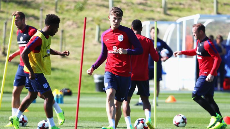 BURTON-UPON-TRENT, ENGLAND - AUGUST 30: John Stones of England passes during an England training session at St George's Park on August 30, 2016 in Burton-u