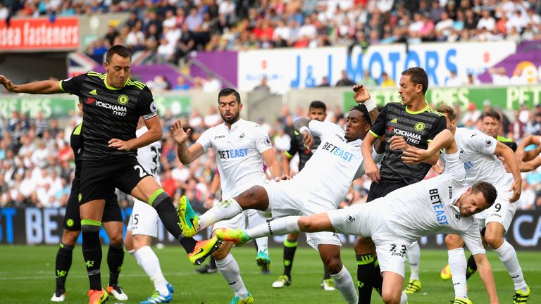 SWANSEA, WALES - SEPTEMBER 11:  John Terry and Nemanja Matic of Chelsea battle with Jordi Amat, Leroy Fer and Gylfi Sigurdsson of Swansea City during the P