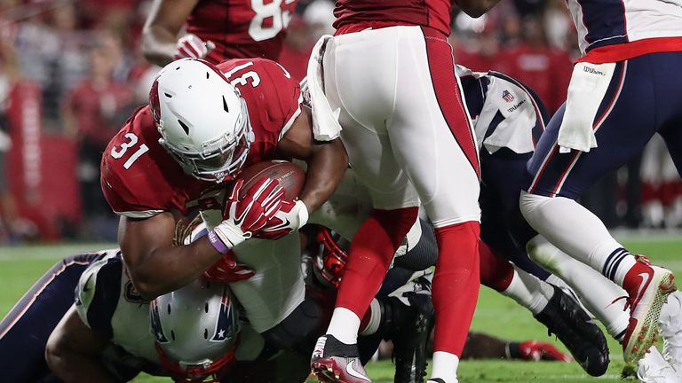 GLENDALE, AZ - SEPTEMBER 11:  Running back David Johnson #31 of the Arizona Cardinals scores on a one yard touchdown rush against the New England Patriots 