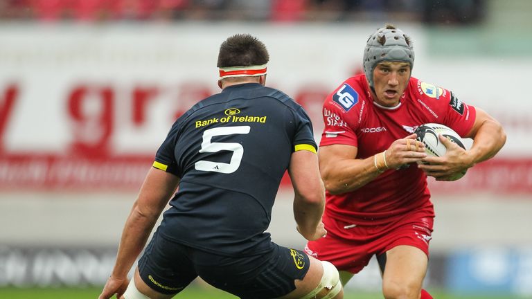 Guinness PRO12, Parc y Scarlets, Llanelli 3/9/2016.Scarlets vs Munster.Scarlets' Jonathan Davies with Billy Holland of Munster.