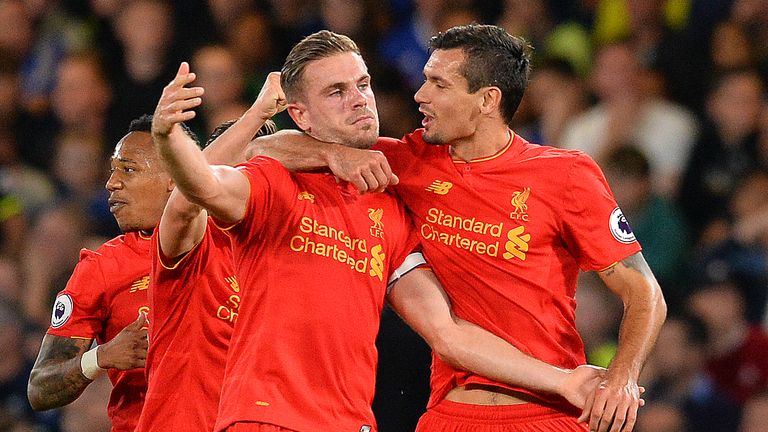 Liverpool midfielder Jordan Henderson (C) celebrates with Dejan Lovren