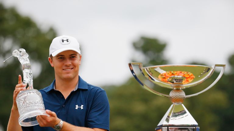 ATLANTA, GA - SEPTEMBER 27:  Jordan Spieth of the United States poses on the 18th green after winning both the TOUR Championship By Coca-Cola and the FedEx